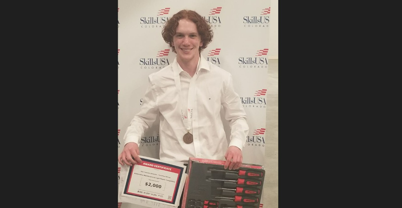 Liberty senior Adrian Veghte wins 3rd place in Skill USA State Championship and hold scholarship certificate and tool set.